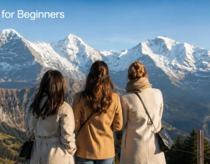Three women overlooking snow-capped Swiss Alps at Männlichen.